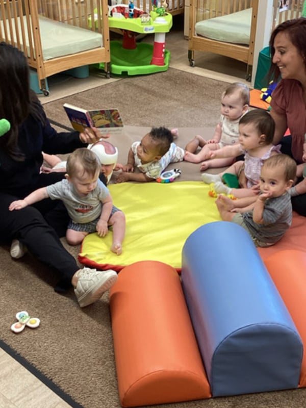 Infants reading a story