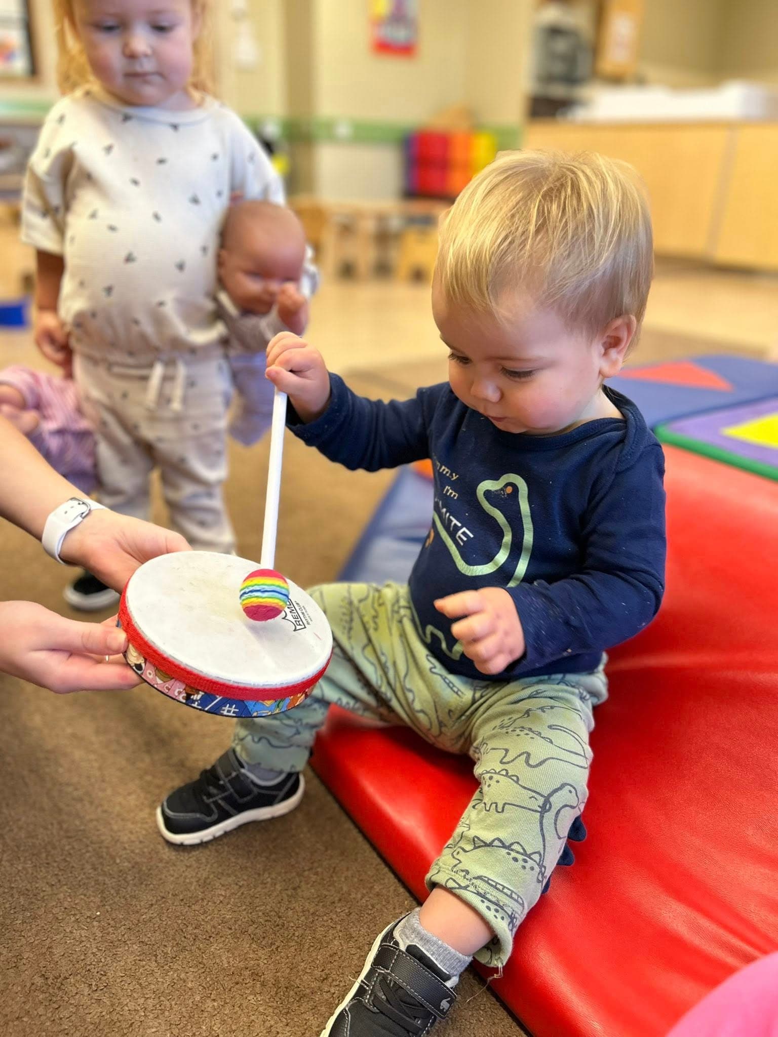 Child hitting a drum