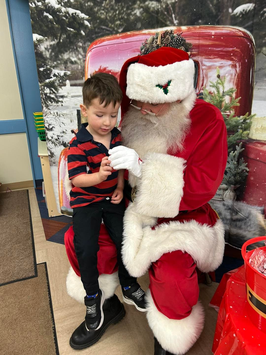 A child sitting on Santa's lap