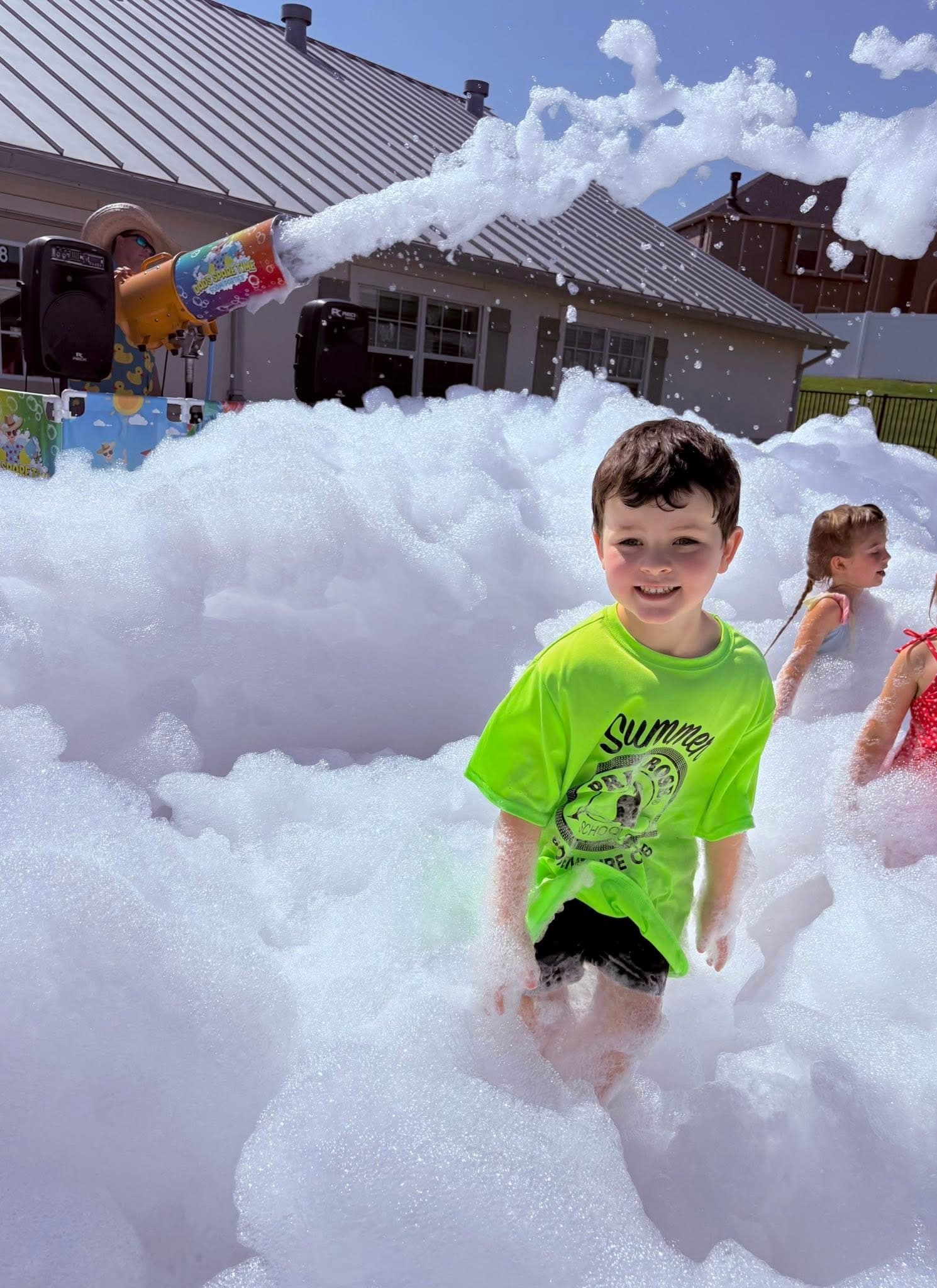 Summer camp children enjoy a foam party at Eagle Ranch summer camp preschool.