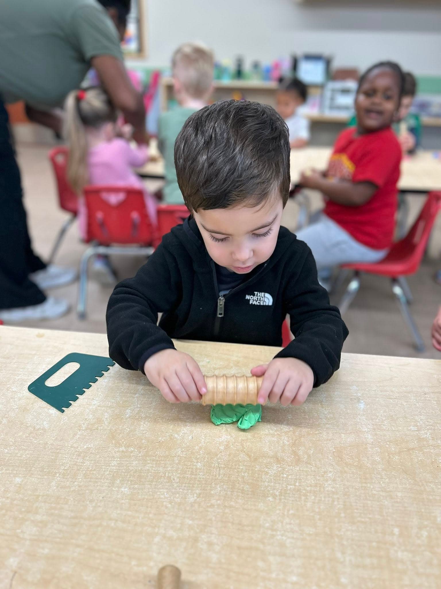 A child playing with modeling dough!