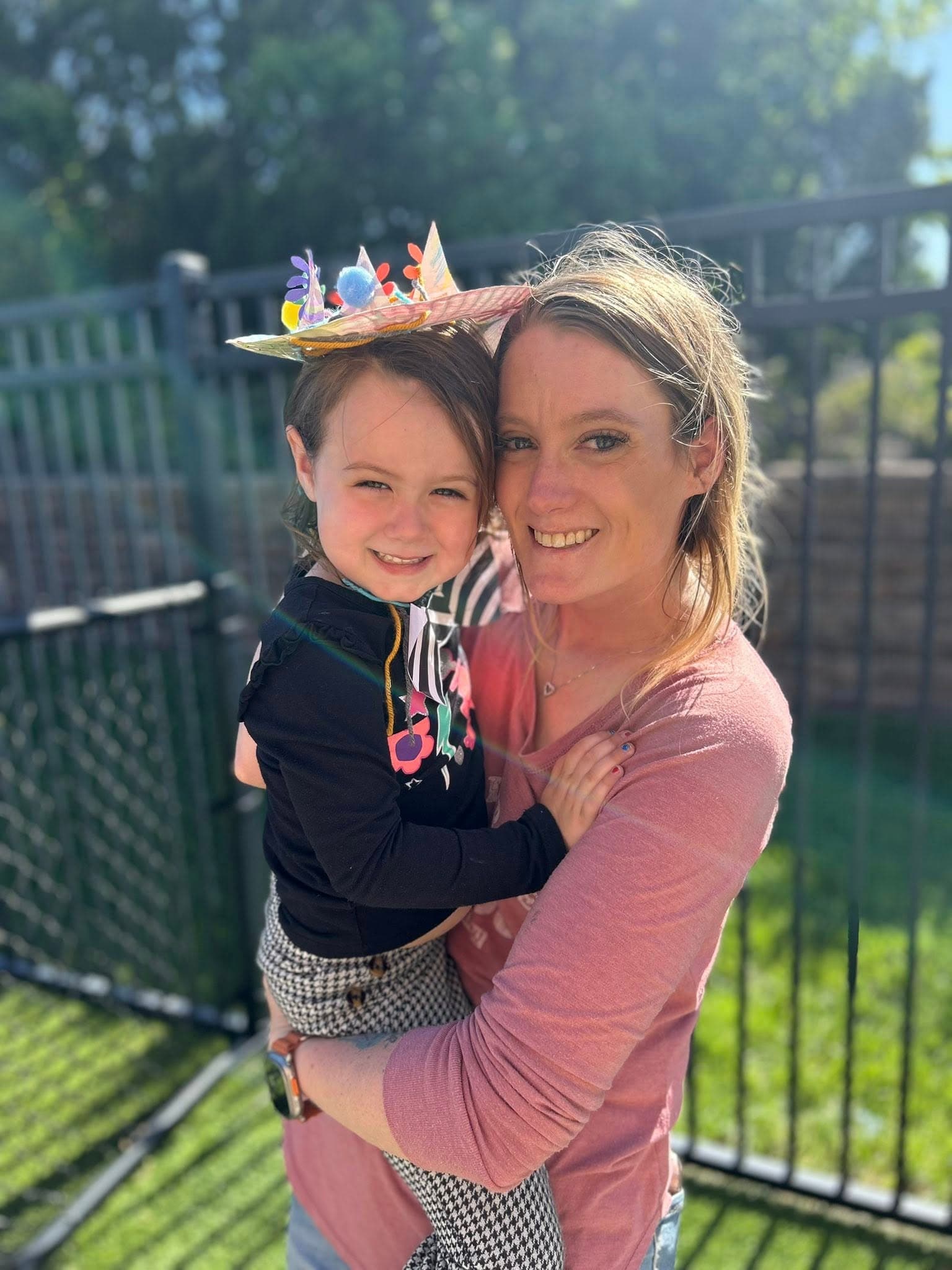 a mom holding her daughter