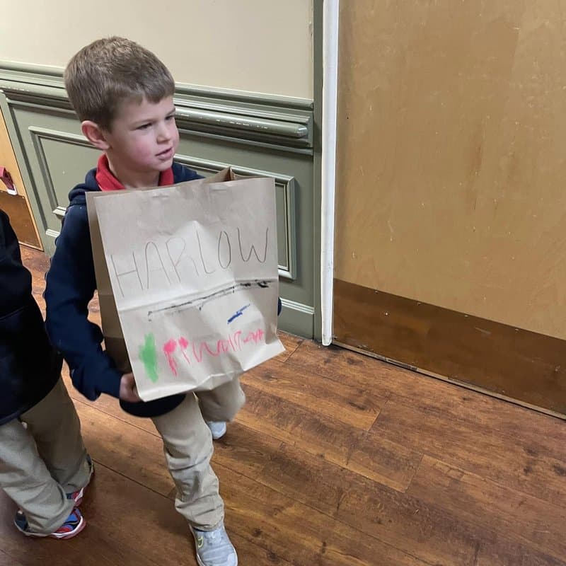 Preschool child participating in a creative classroom activity at Primrose School at Highlands Ranch Business Park in Highlands Ranch, CO.