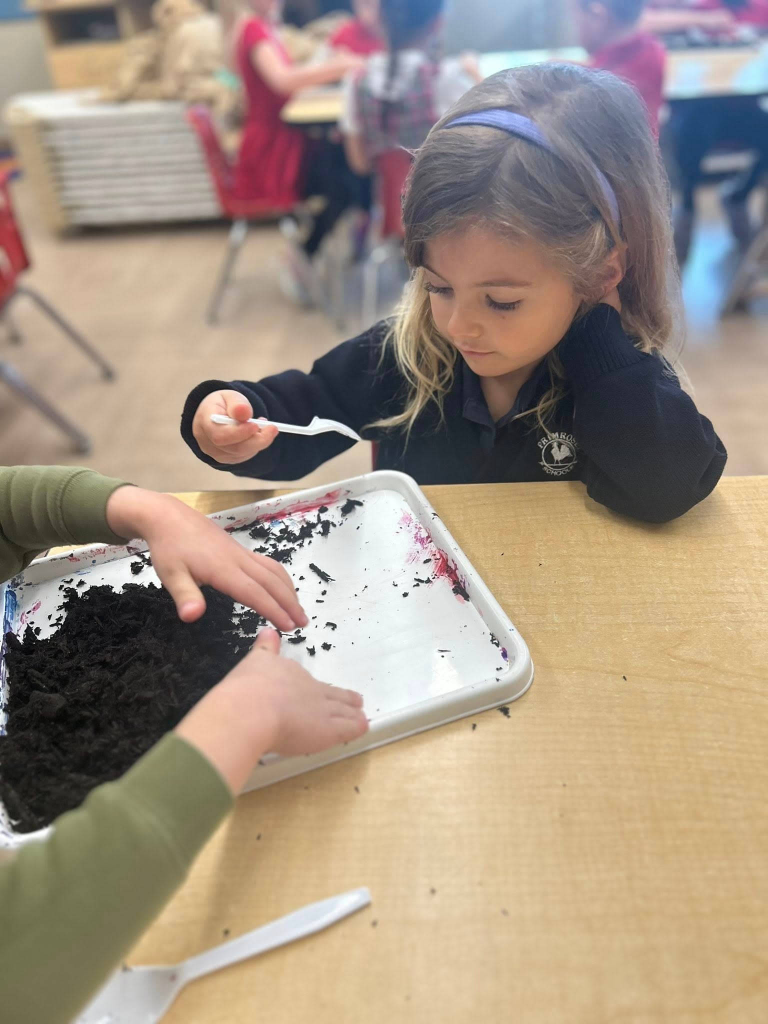 Child exploring soil