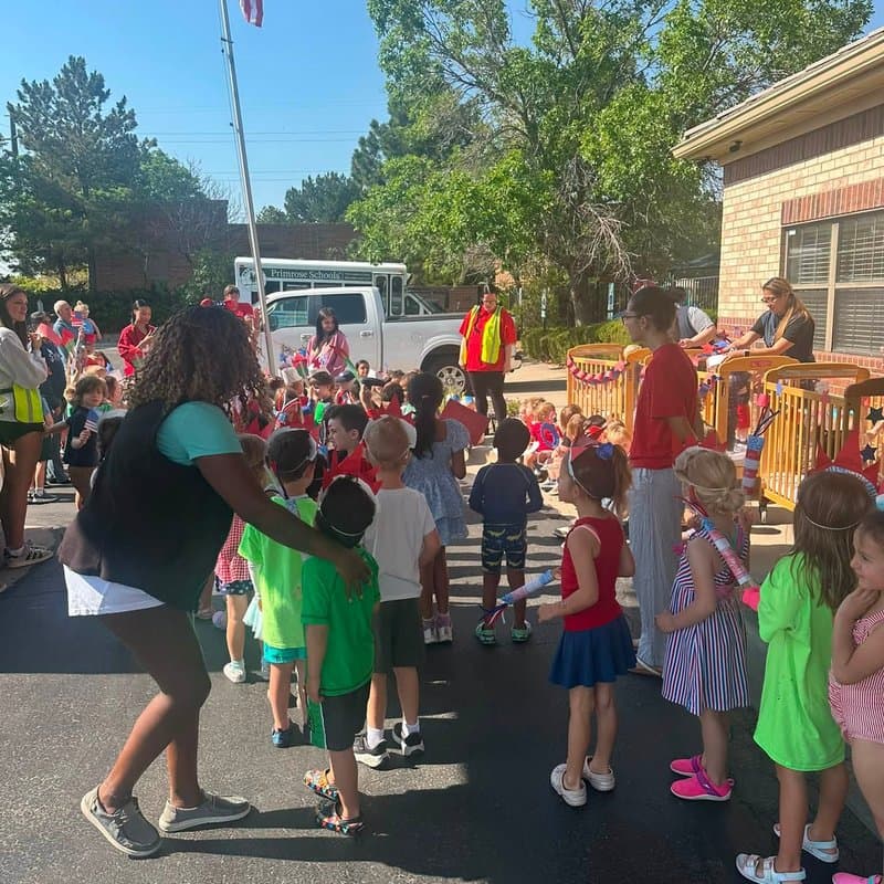 Children and teachers gathering for an outdoor school celebration at Primrose School at Highlands Ranch Business Park in Highlands Ranch, CO.