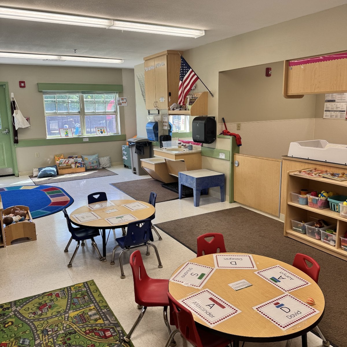 Toddler classroom with learning tables and activity areas at Primrose School of Chelmsford in Chelmsford, MA