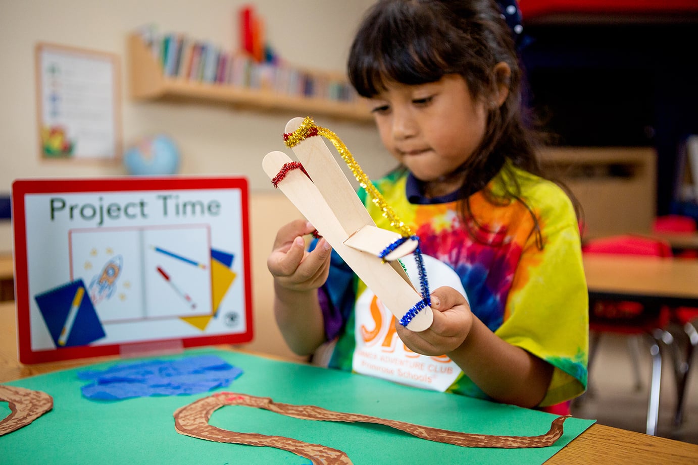 young student doing an art project