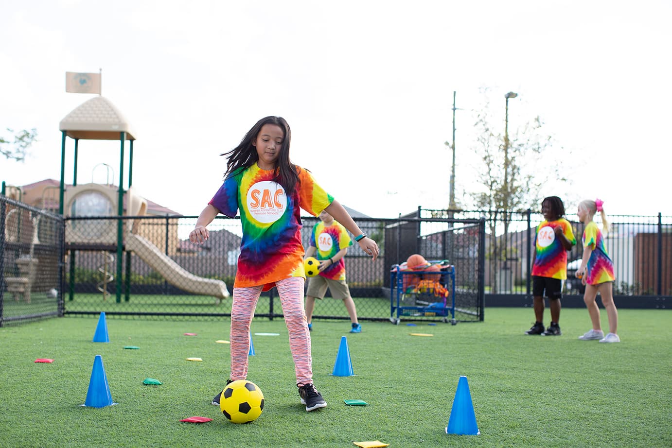 young girl playing soccer