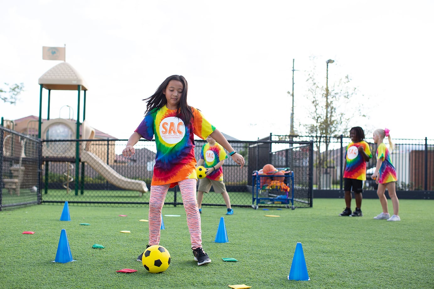 young girl playing soccer
