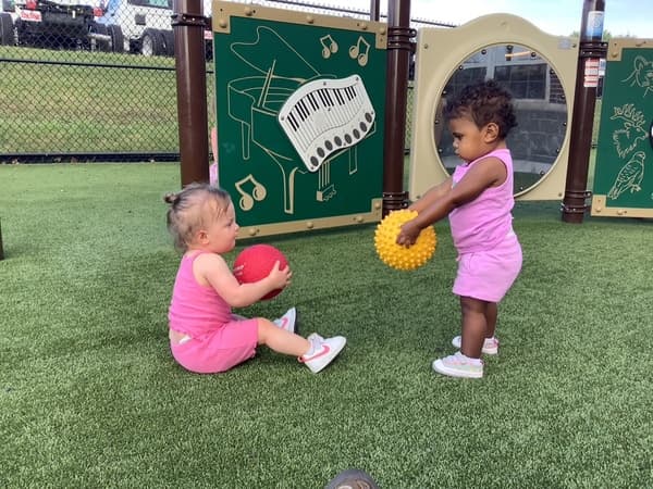 Toddlers playing outside