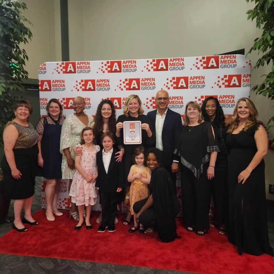 teachers holding award for best of north atlanta