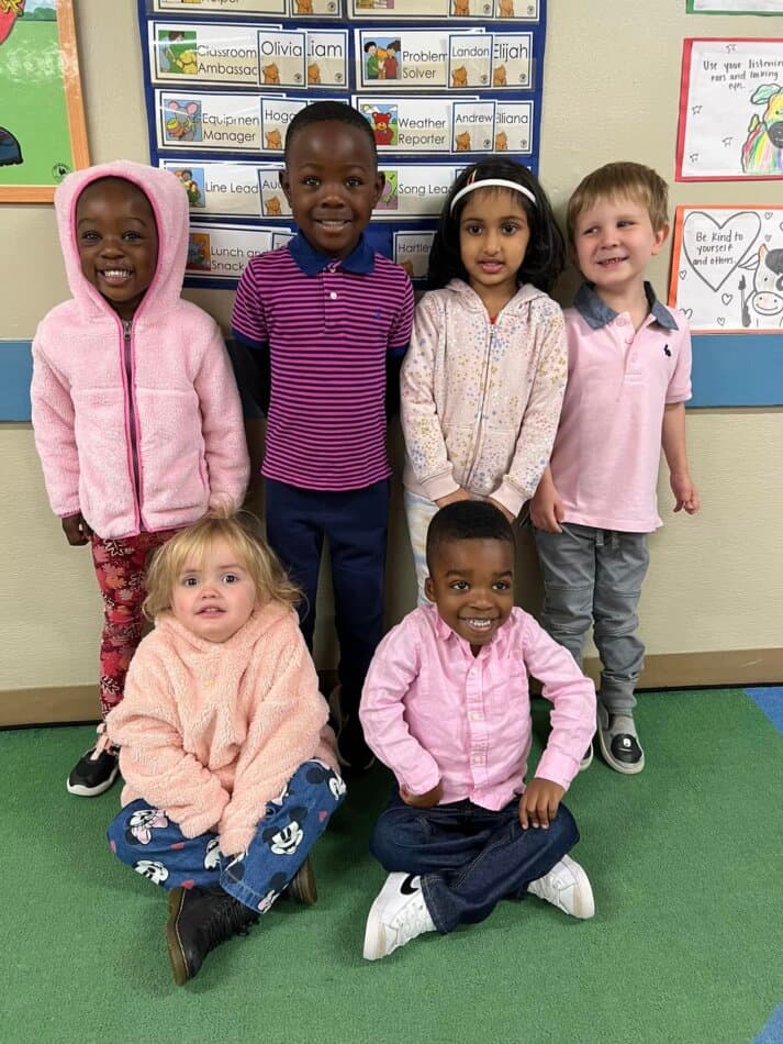 children dressed in pink
