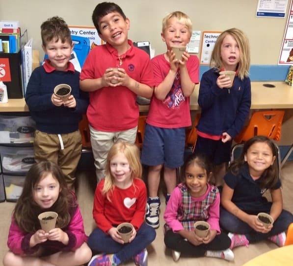 children holding plants