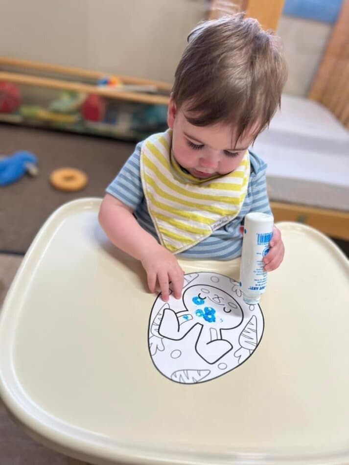 toddler completing art project