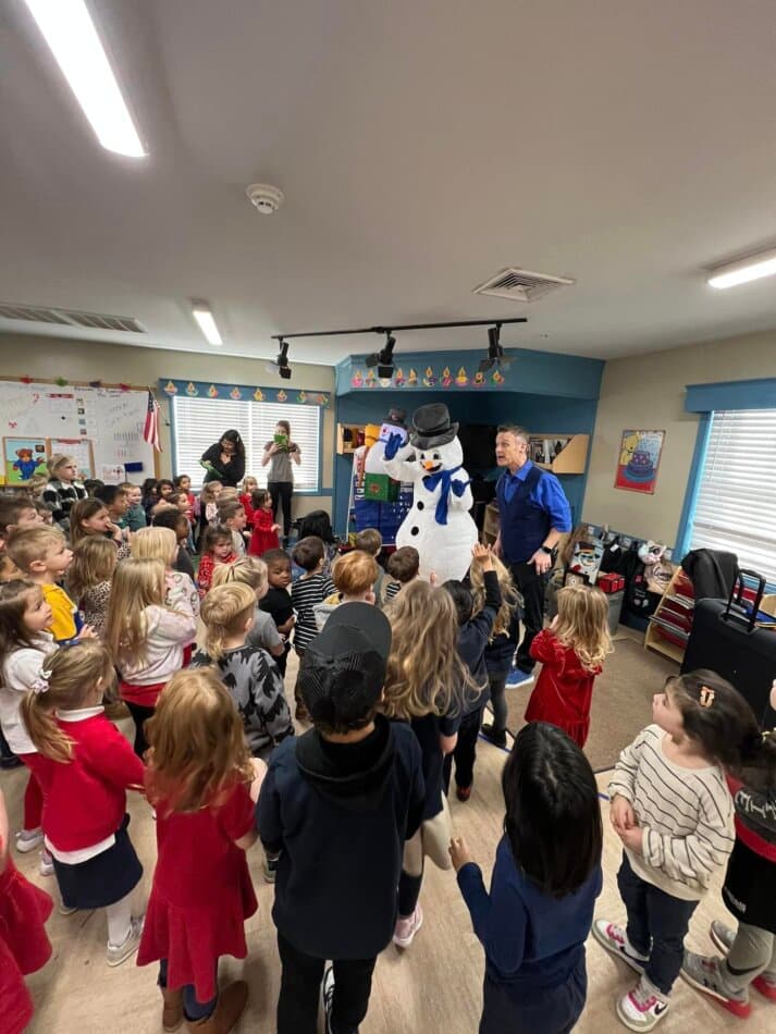 children watching a magic show