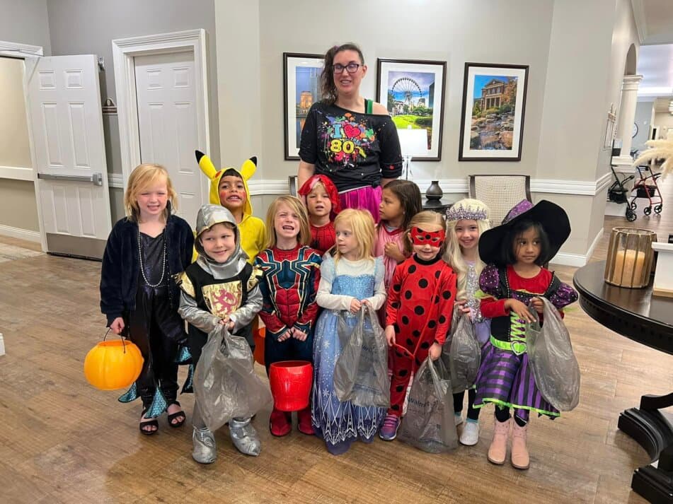 children dressed in halloween costumes