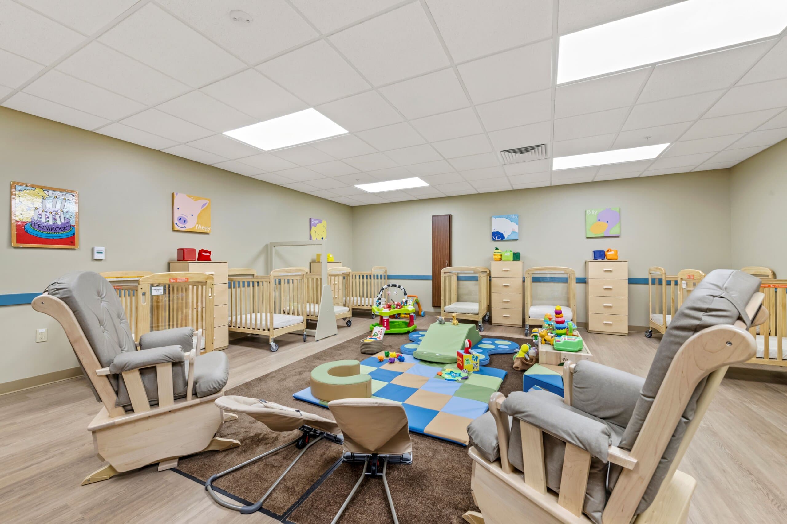 Classroom with cribs and rocking chairs