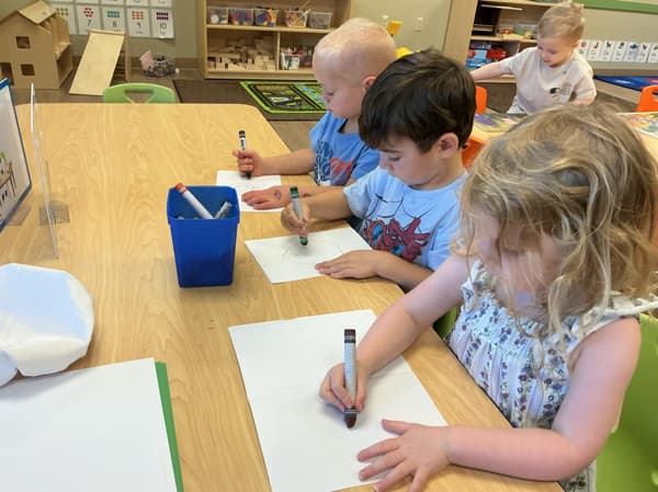 Preschool student creating a hands-on art project during a fine motor and creative learning activity at Primrose School of Forest Hill in Forest Hill, Maryland