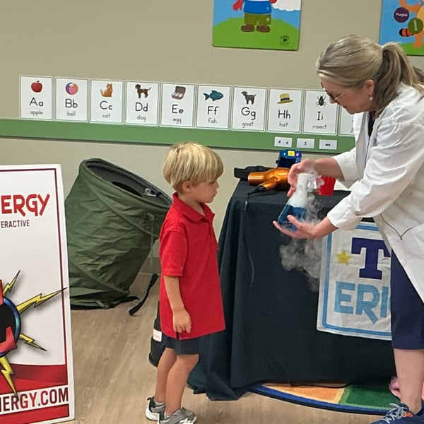 Children at Primrose School of Forest Hill participating in an interactive Eric Energy science show, exploring hands-on STEM experiments and learning through exciting demonstrations.