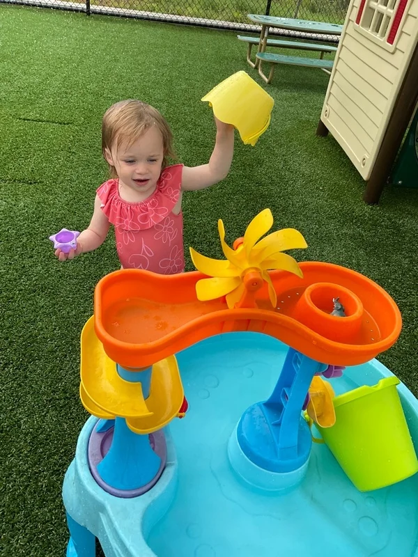 Toddler playing in the water