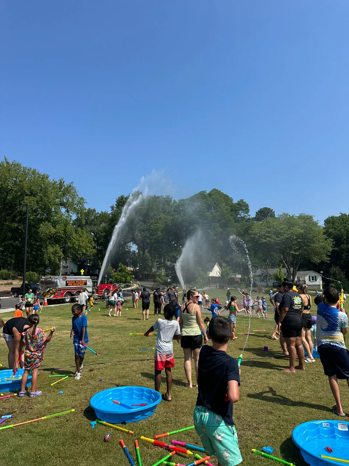kids playing with water blaster and other water activities