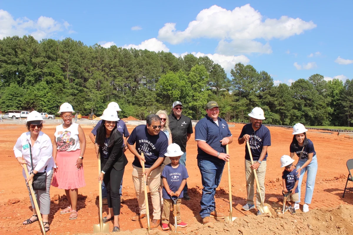owners of Primrose school of waxhaw celebrating start of construction of preschool