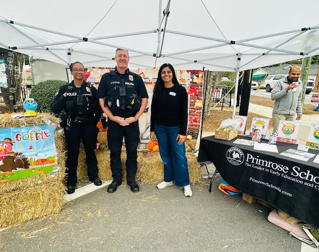 picture of 2 police officers and Sneha in our photo booth