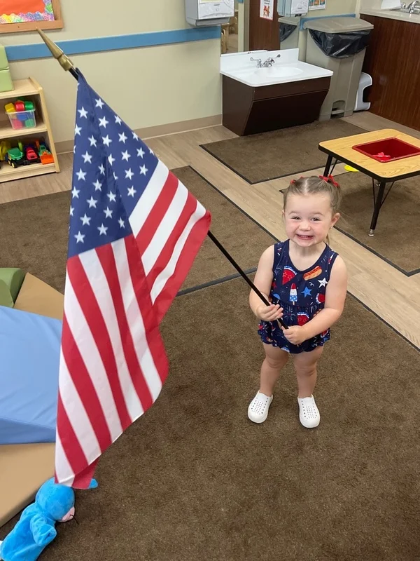 primrose student with the flag