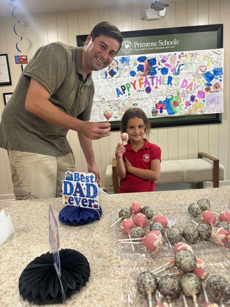 Dad and daughter enjoying cake pops
