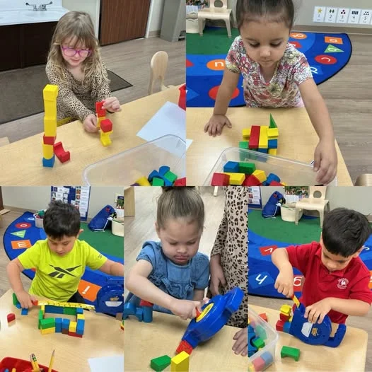Preschoolers building colorful block structures during a collaborative STEM activity that encourages creativity, teamwork, spatial awareness, and problem-solving at Primrose School.