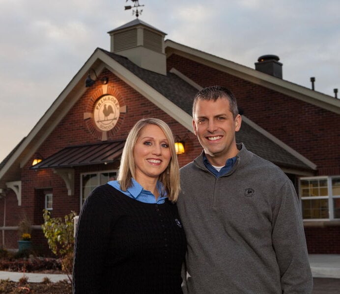 Diane and Darren Storkamp, Primrose School of Eagan owners since 2011, in a preschool setting symbolizing family-owned, Cognia-accredited childcare and early education in Eagan, MN.