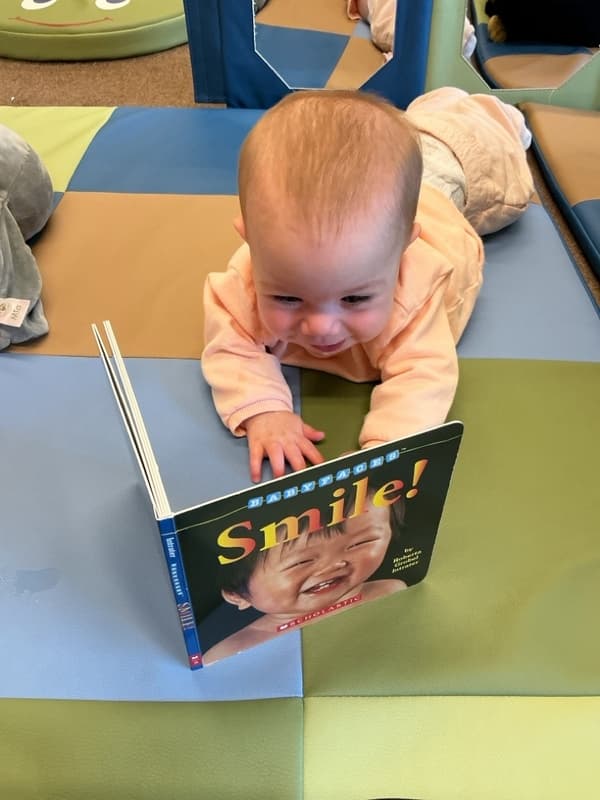 Baby Smiling at Book