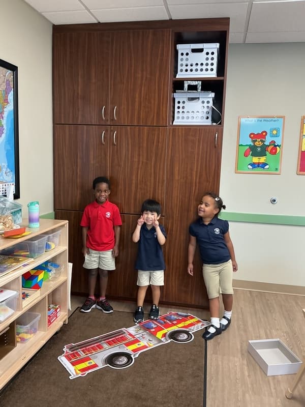 kids with a fire truck puzzle