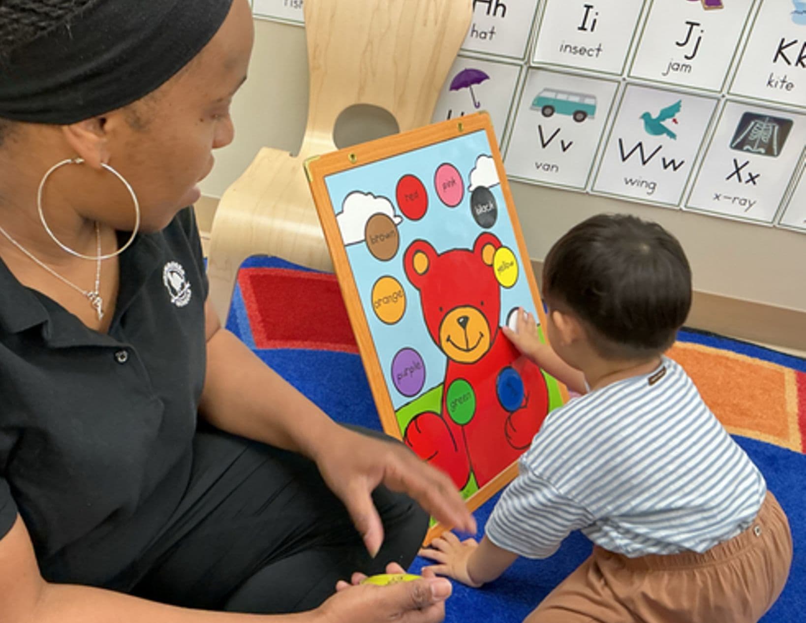 toddler boy learning colors