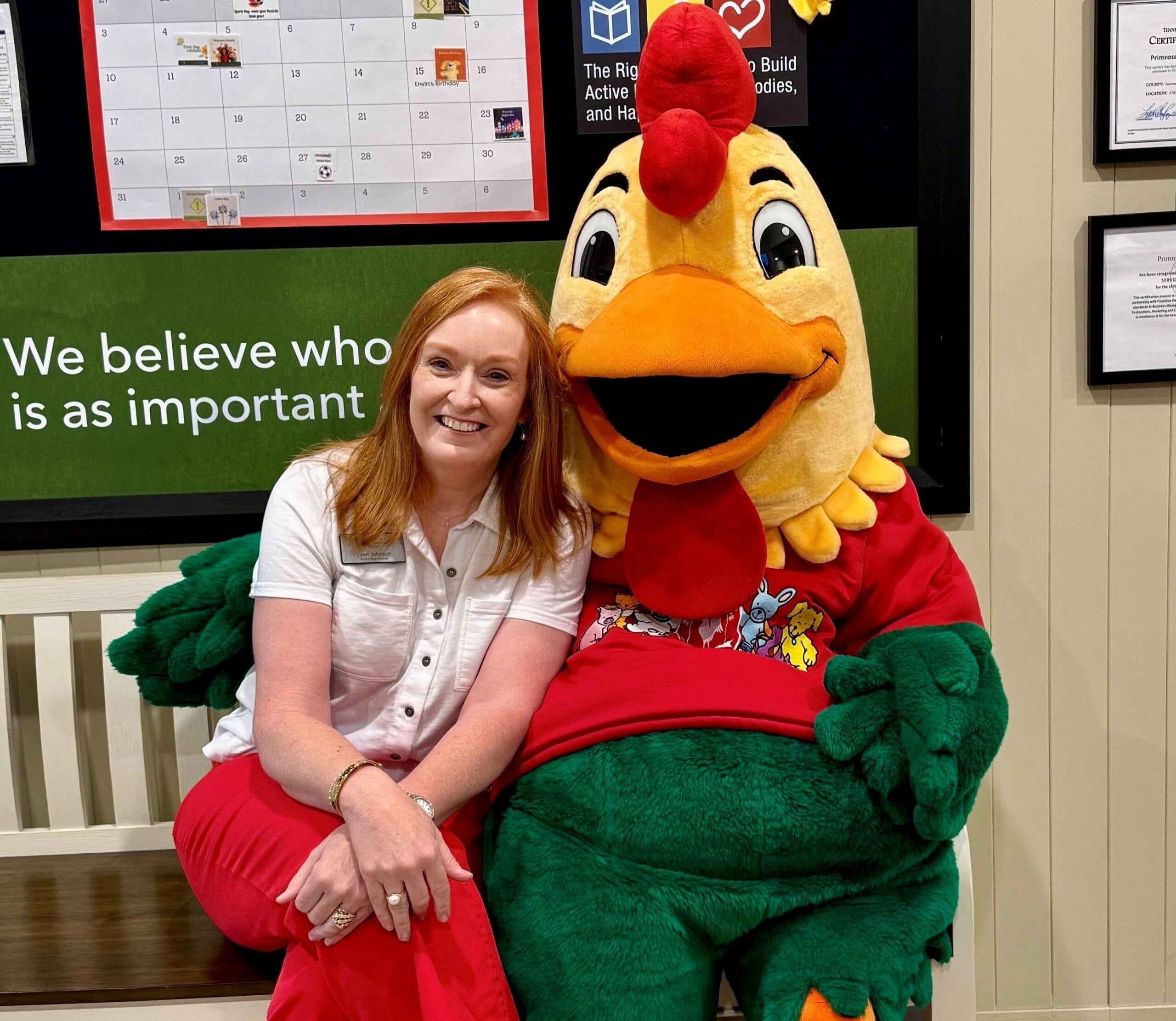 Franchise Owner, Lynn Johnson, and Percy the Rooster