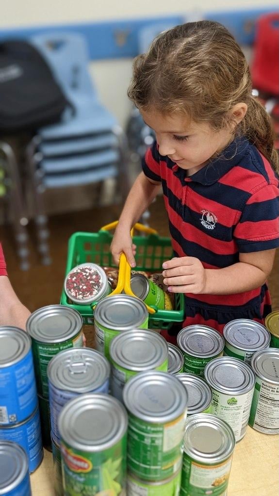 primrose pre-k student shopping for canned goods