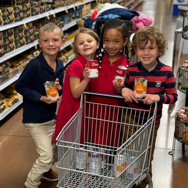 pre-k students shopping for can food drive