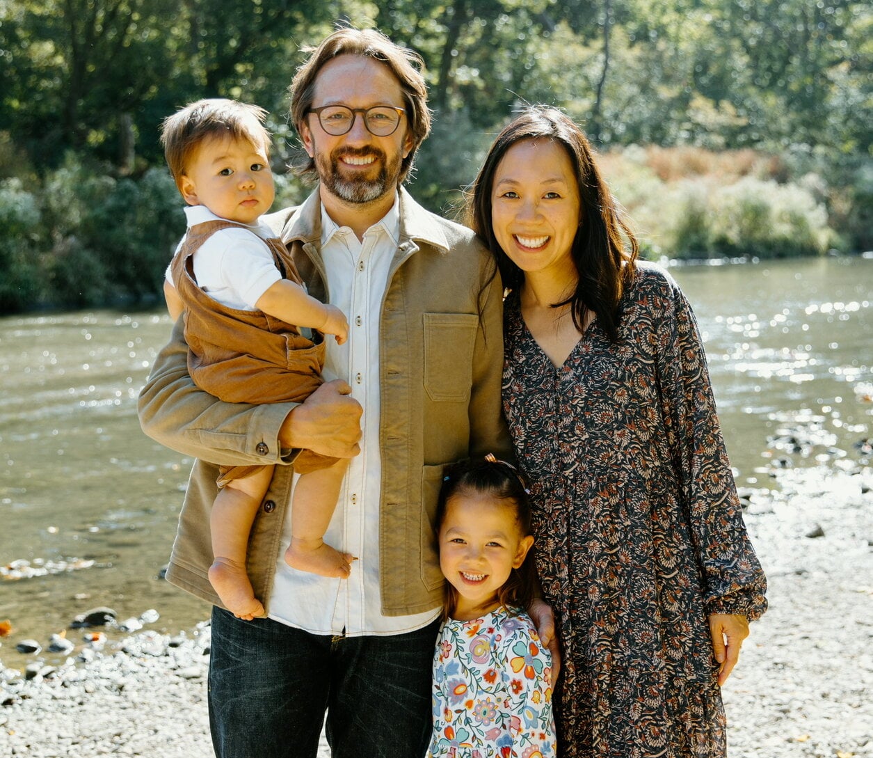 Picture of CJ Bak with his wife, daughter and son in front of a creek.