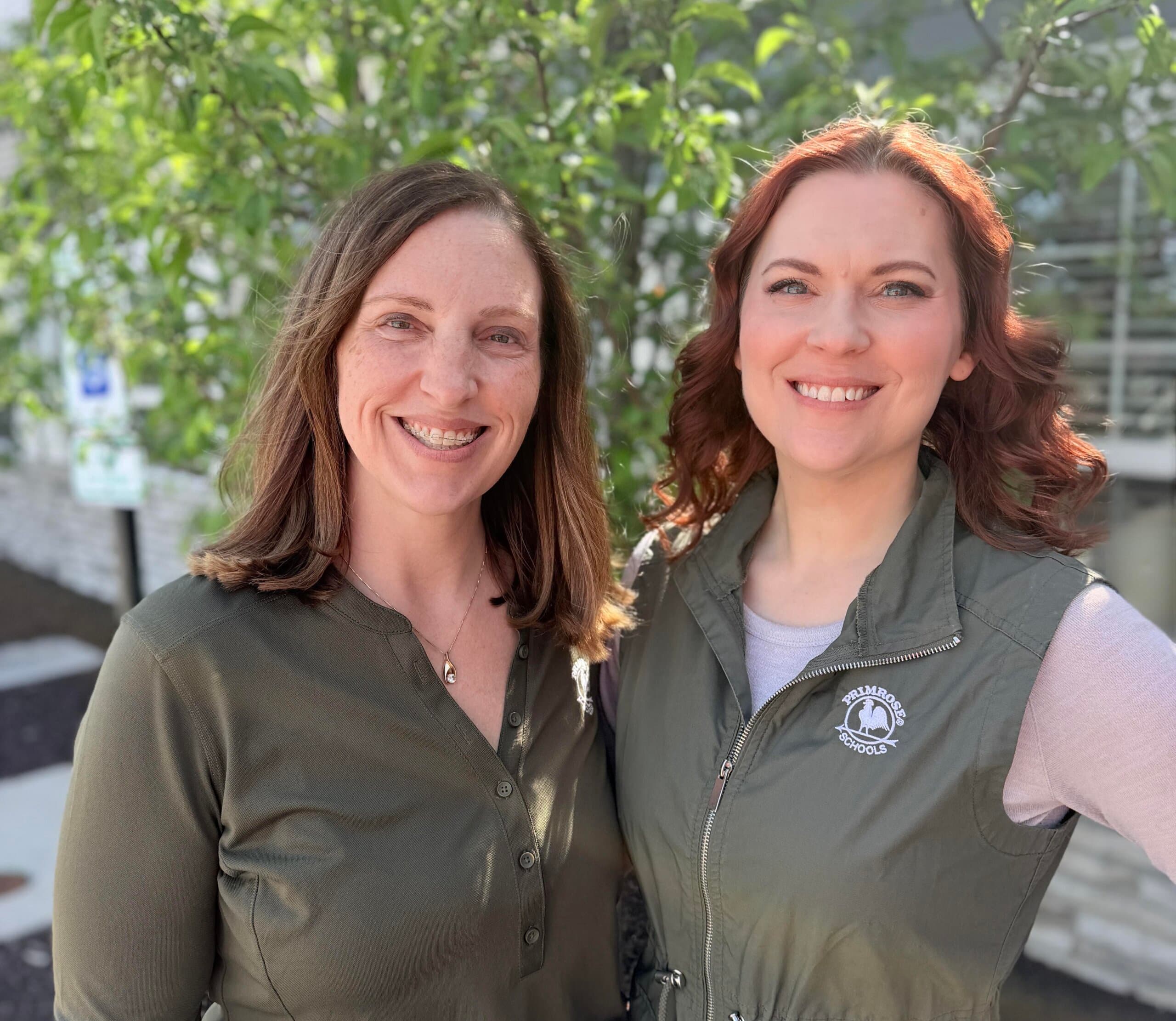 franchise owners lyndi mcvey and megan sifert standing in front of the school