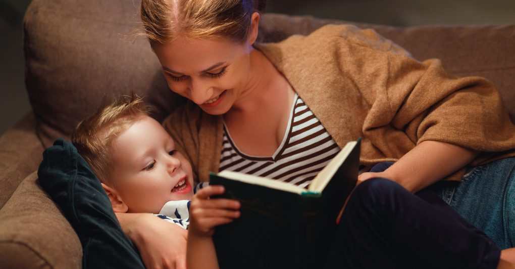 Child and parent reading together