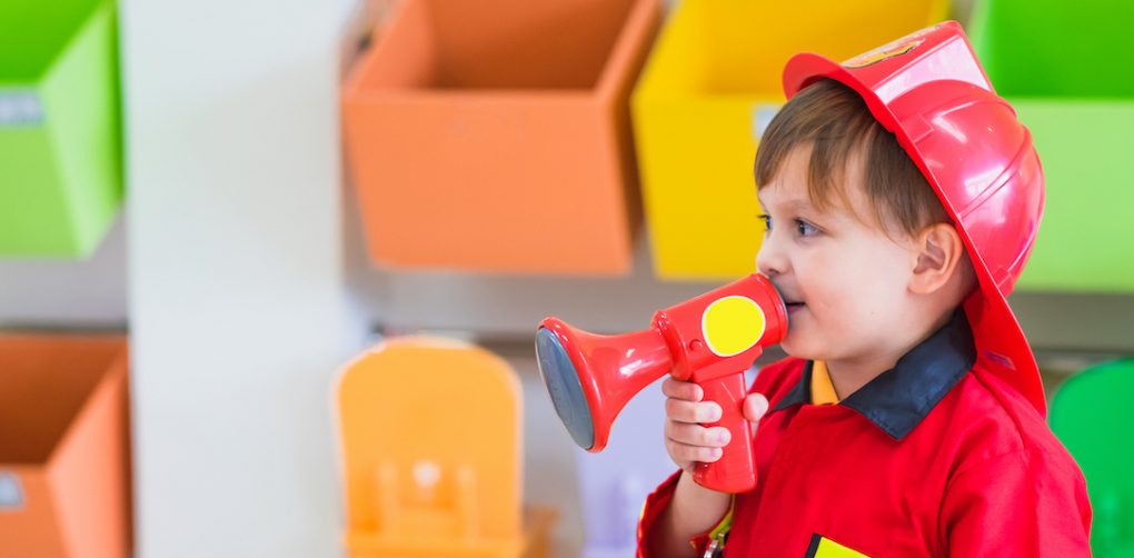 Preschooler dressed up as firefighter