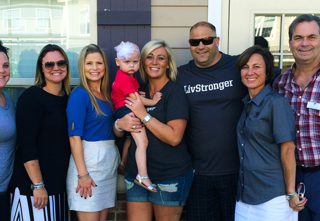 A group of Primrose parents and teachers with little Olivia, at a fundraiser for her leukemia treatment