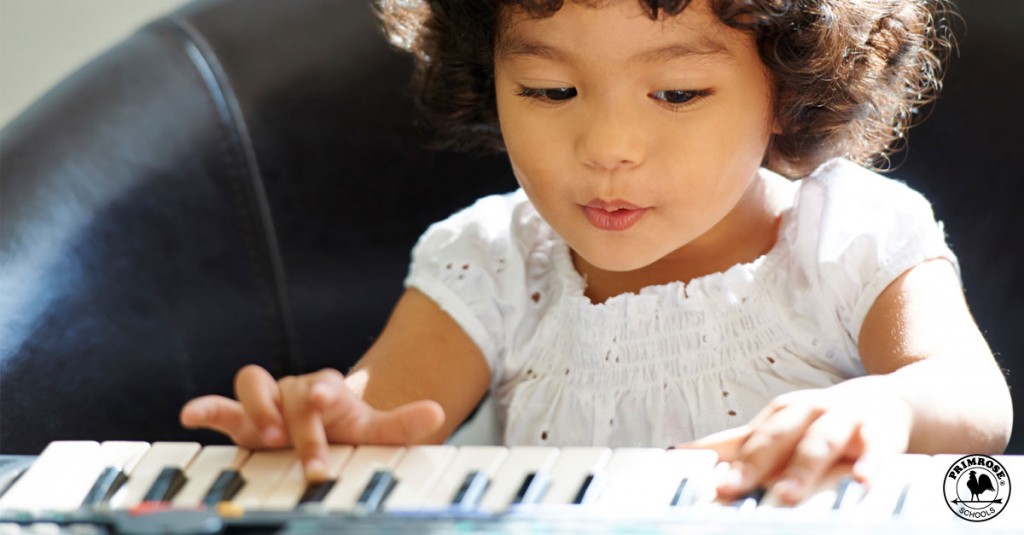 Toddler playing piano