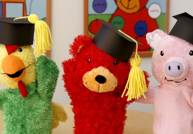 Primrose puppets celebrating graduation with little graduation hats