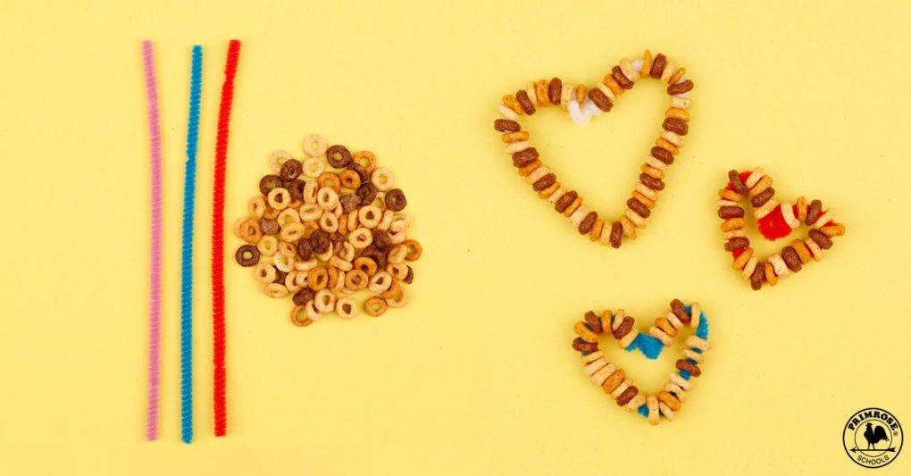 Heart-shaped bird feeders made with cereal and pipe cleaners