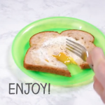 A piece of toast with a fried egg inside