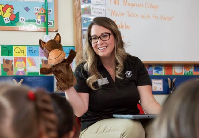 Primrose Teacher holding Peanut the Pony to teach about honesty