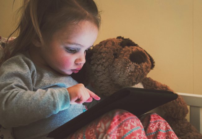 Child watches Kid's Youtube videos on tablet.